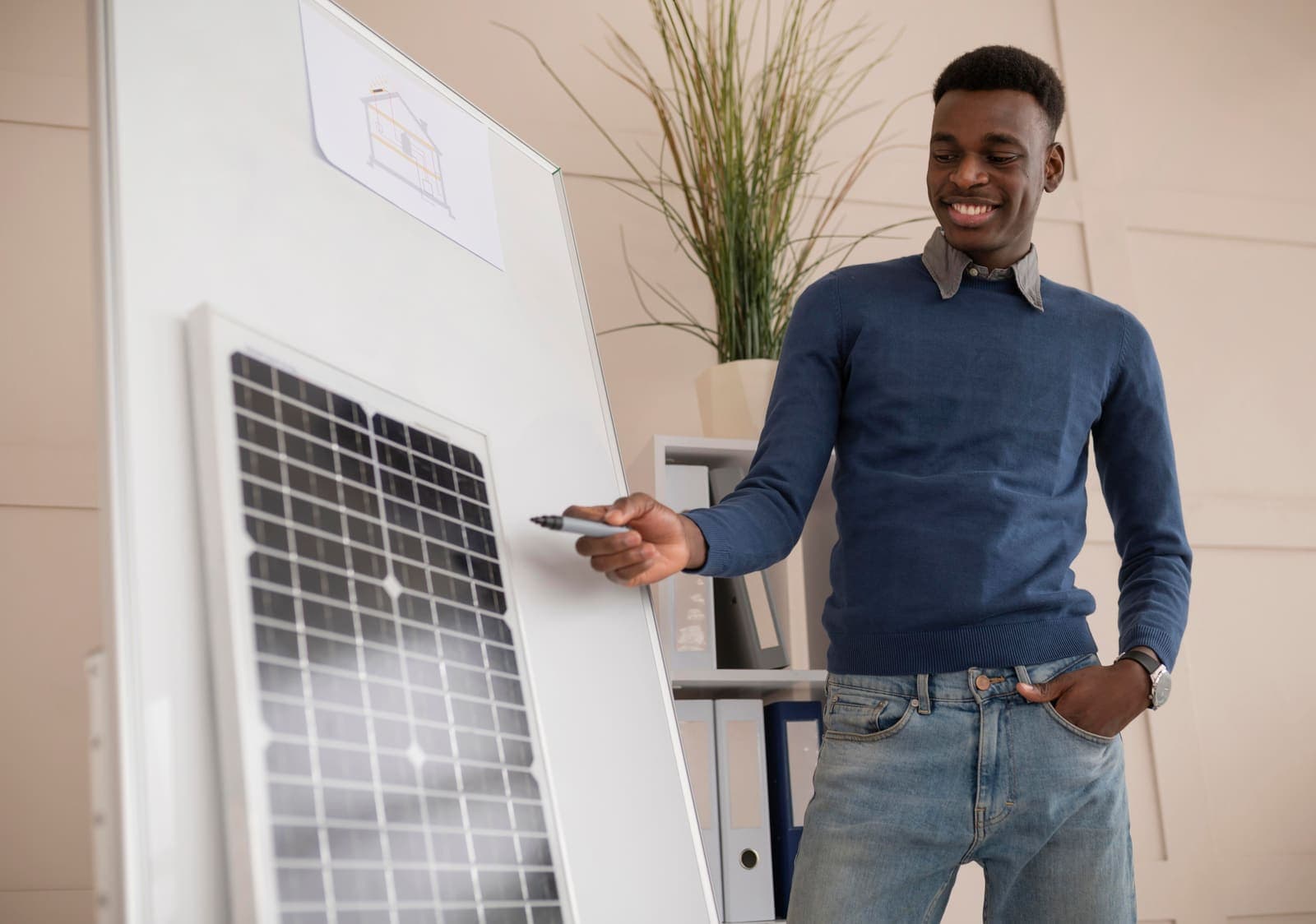 A GenieApps solar consultant reviewing a panel